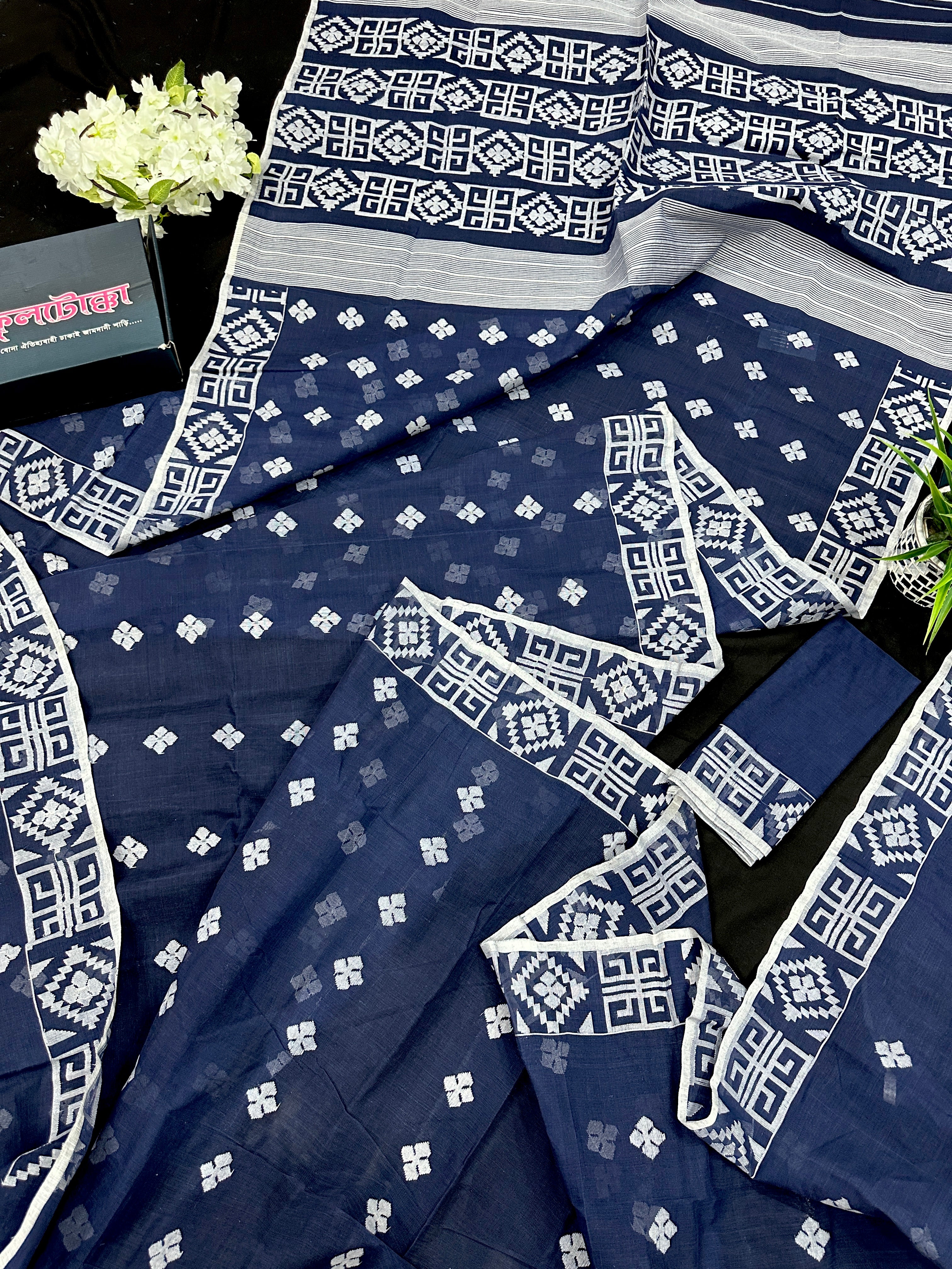 Deep blue jandani saree with white threads all over work.