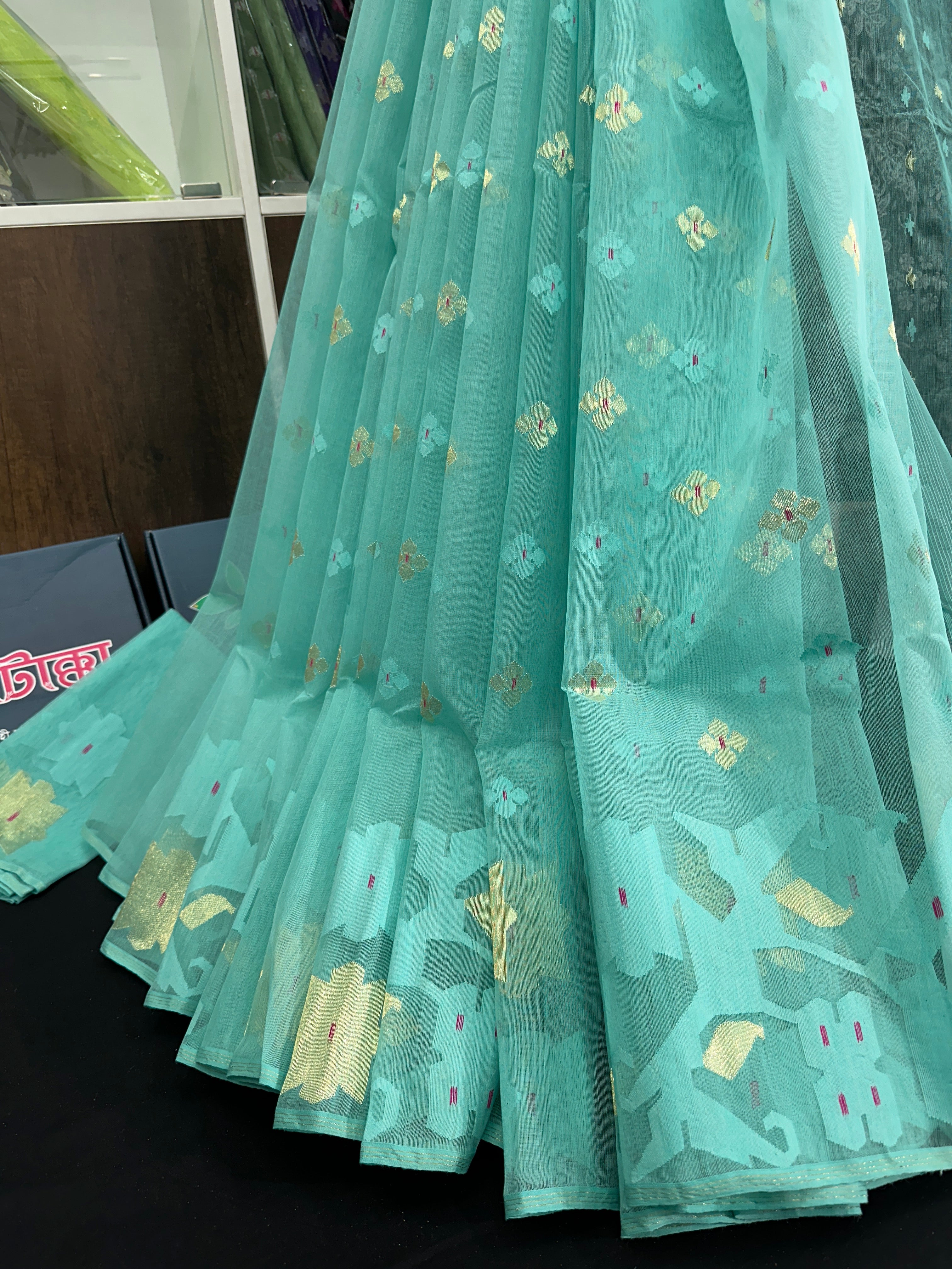 Sky blue halfsilk jamdani saree with golden jori work and self threads work