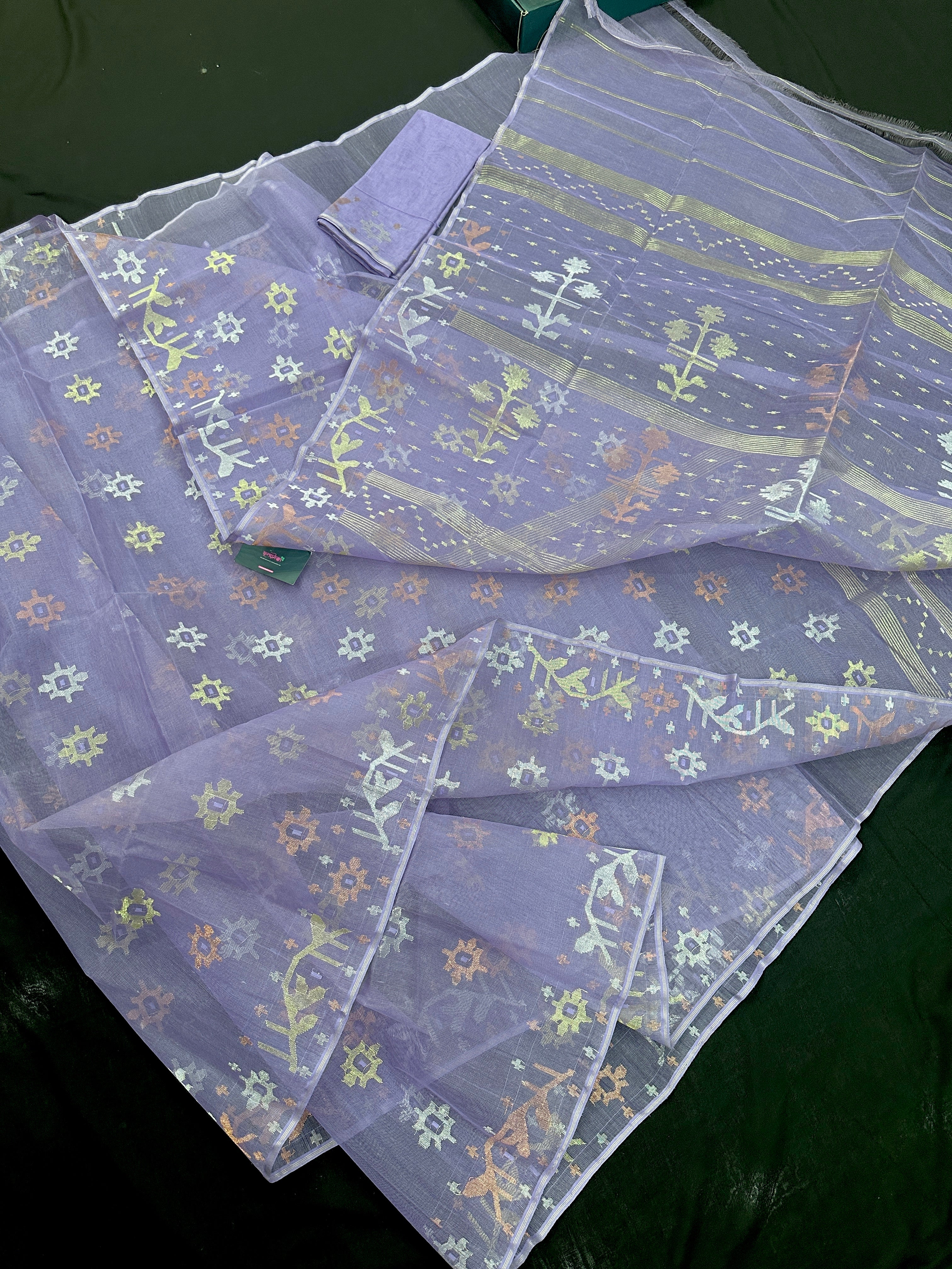 Lite lavender jamdani saree with golden silver copper jori work.