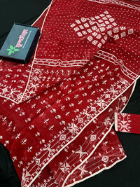 Maroon jamdani saree with white thread work.