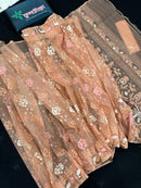 Creamy peach jamdani saree with pink white and peach threads work.