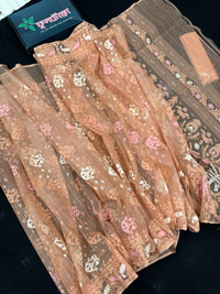 Creamy peach jamdani saree with pink white and peach threads work.