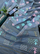 Powdery blue jamdani saree with pink blue and golden jori work.