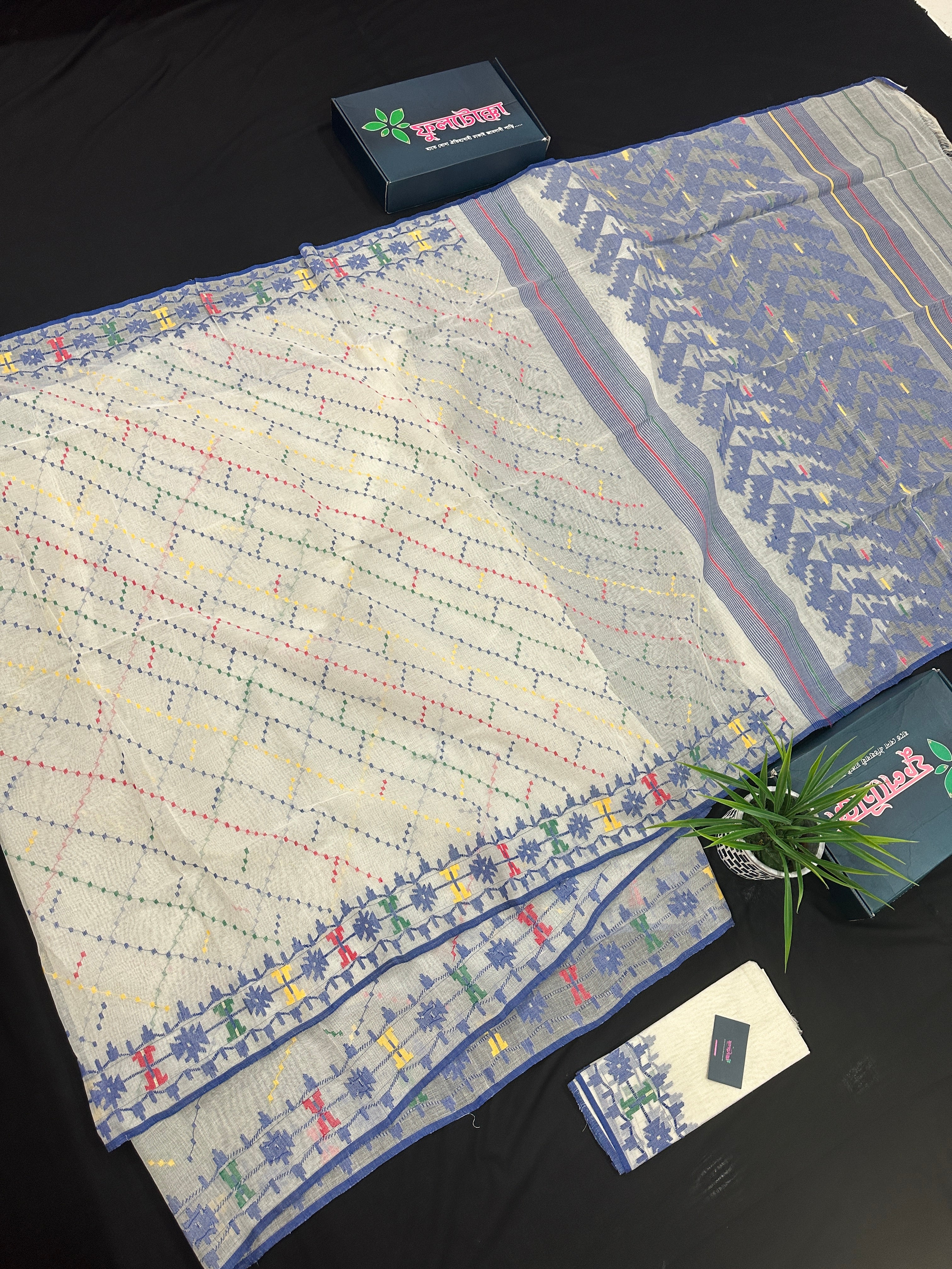 White cotton jamdani saree with blue yellow red green threads work& blouse piece.