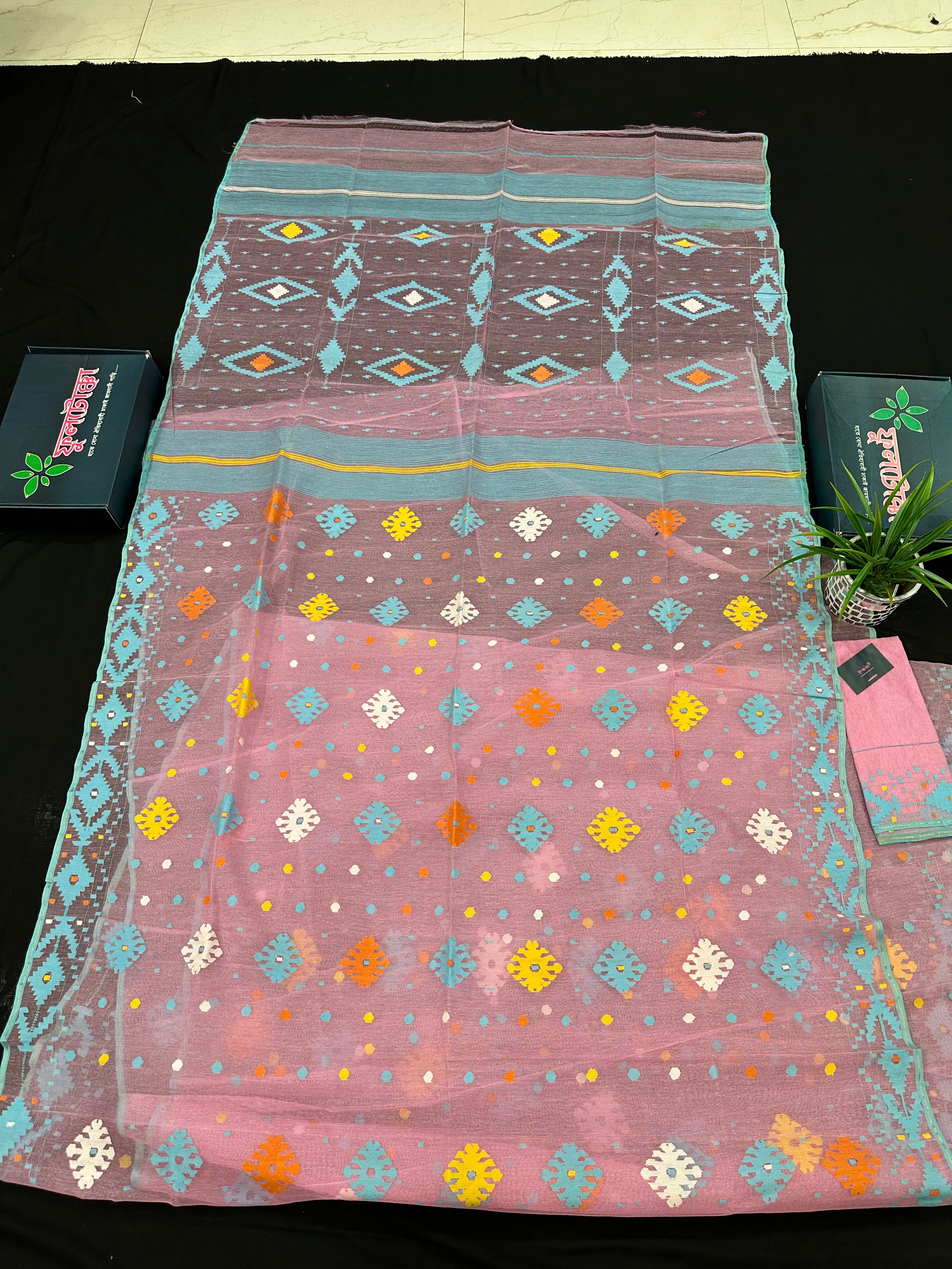Pink jamdani saree with blue white yellow orange threads work and blouse piece.