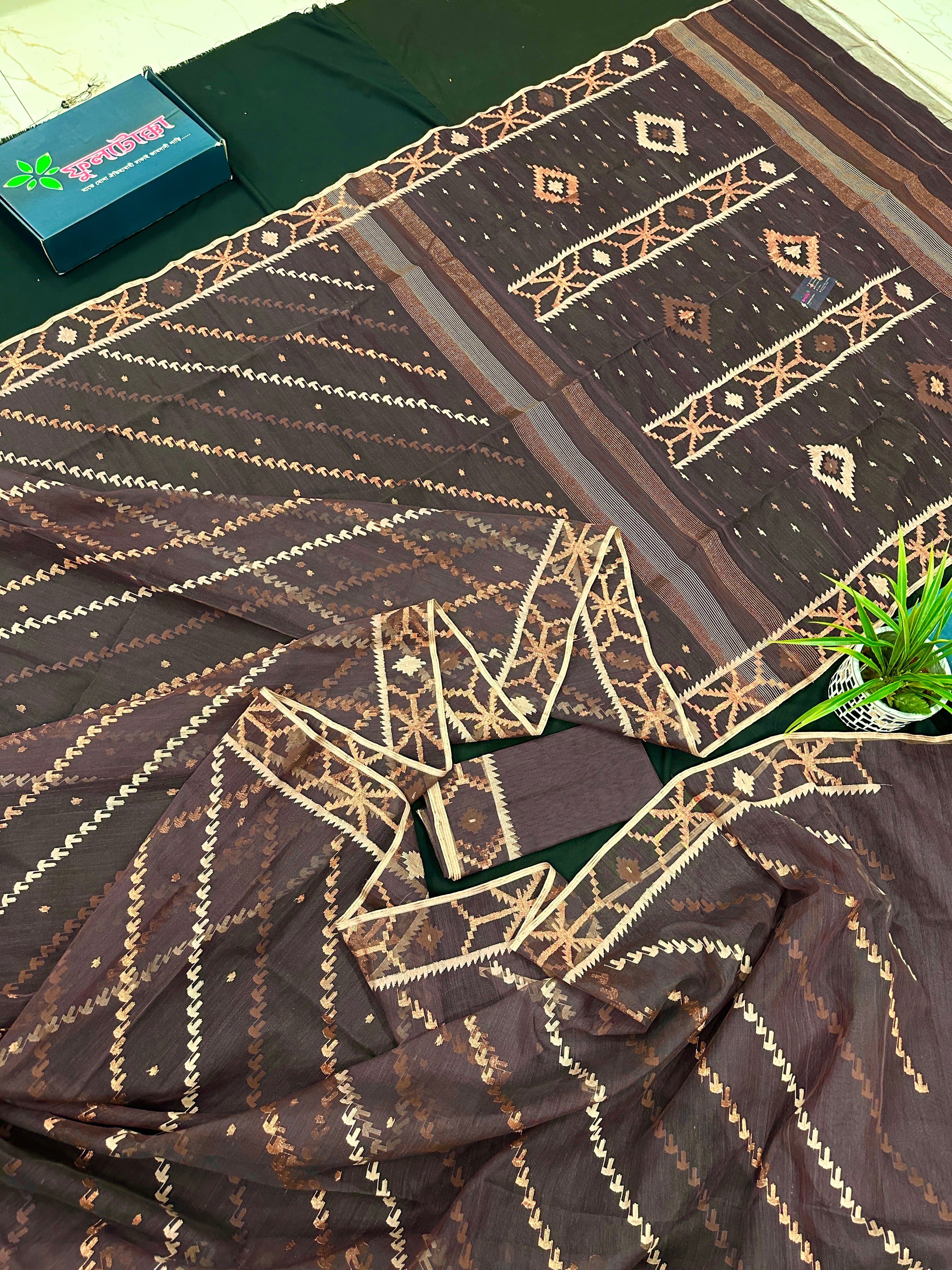 Brown colour jamdani saree with brown & off white threads work.