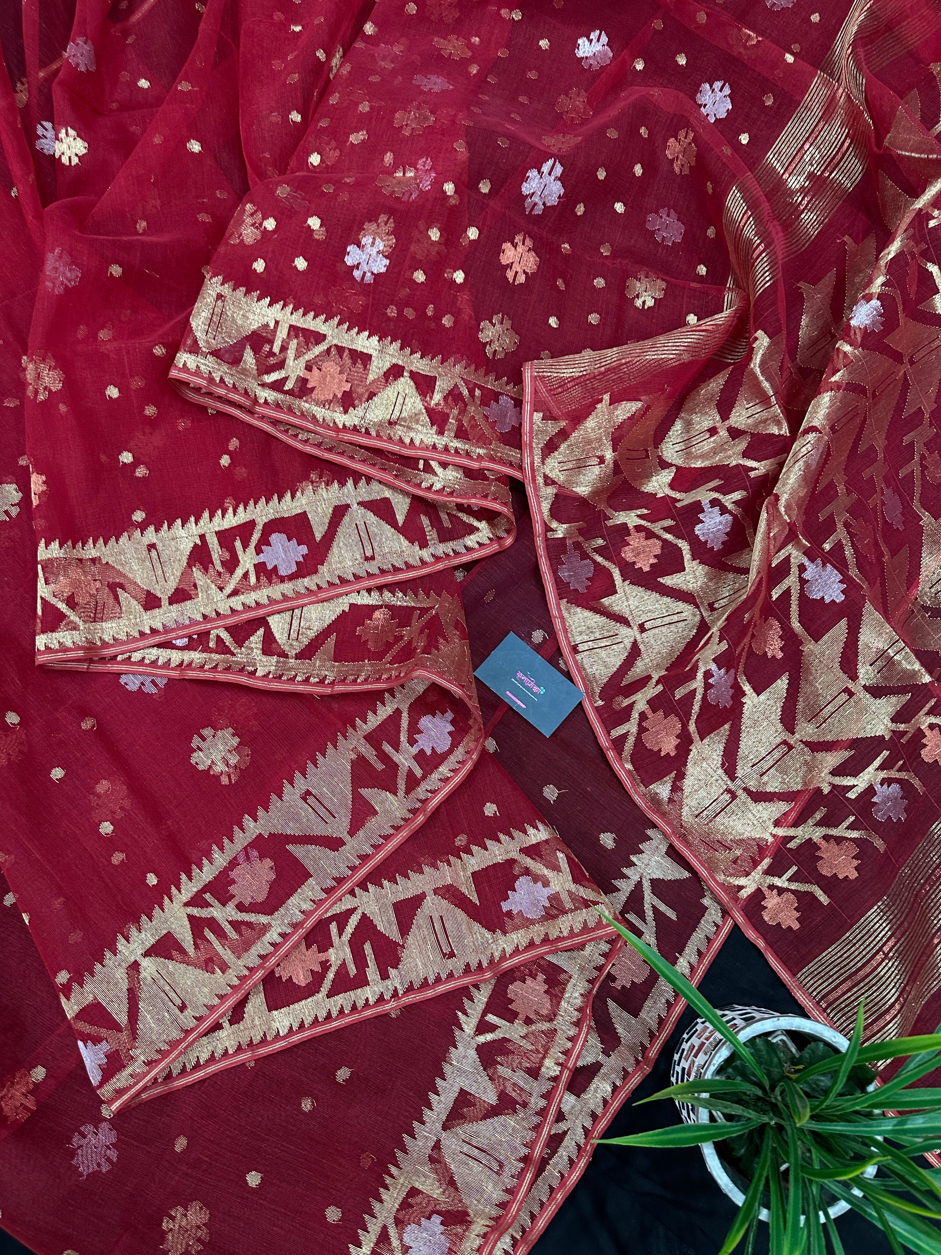 Red jamdani saree with golden jori all over work with blouse piece.