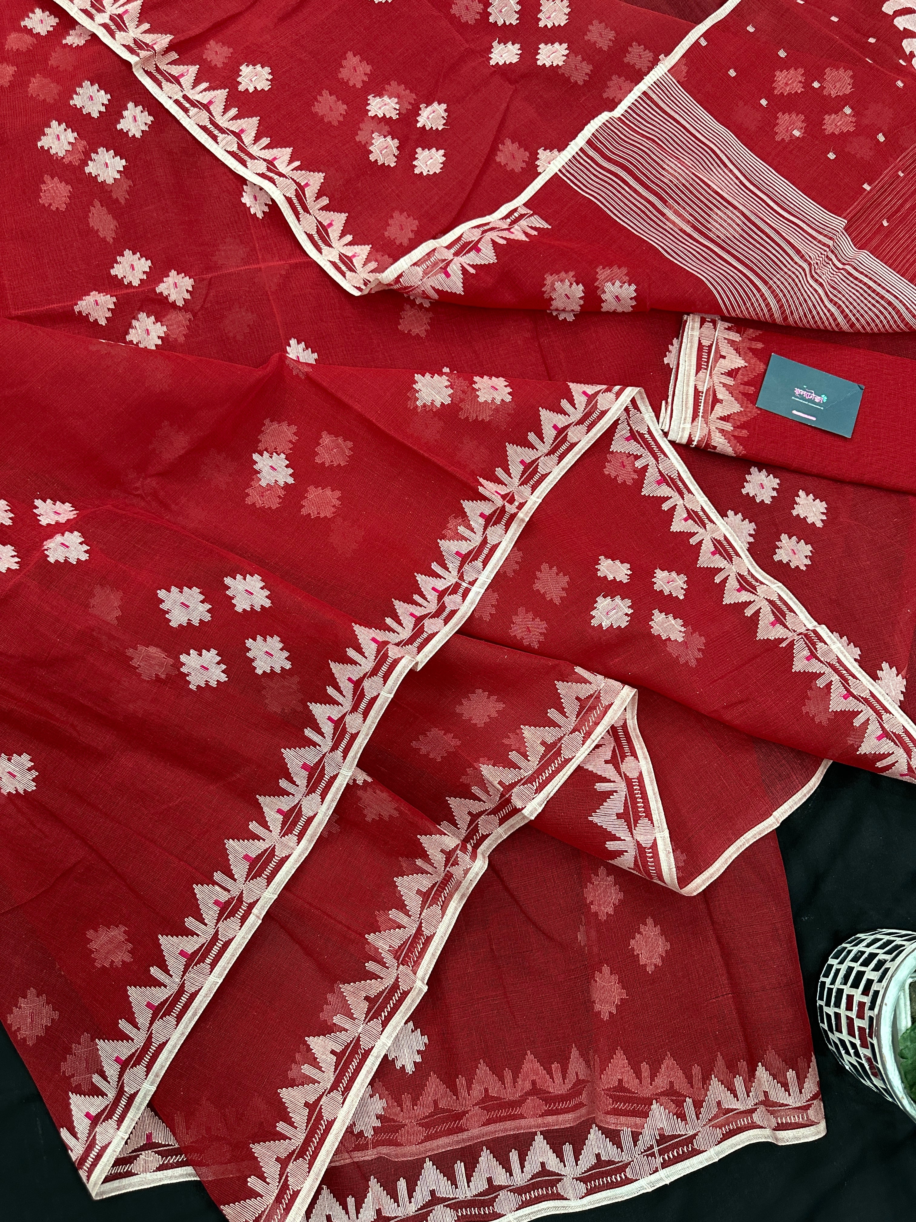 Radish Maroon cotton jamdani saree with white threads work all over work.