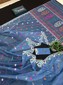 Dusty blue jamdani saree with pink white blue green work and white paar.