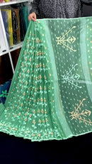 Jade green halfsilk jamdani saree with green off white golden self threads work