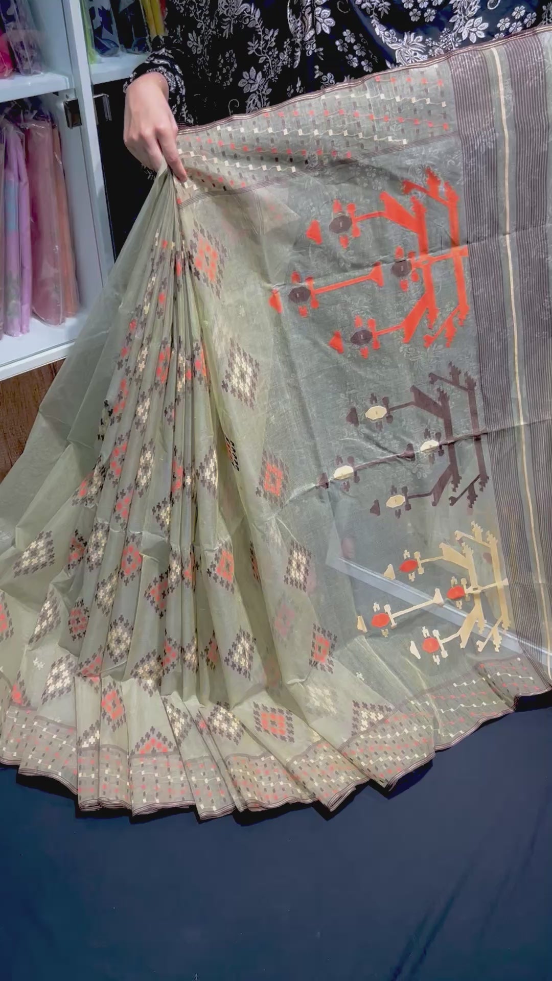 Dark olive halfsilk jamdani saree with orange off white coffe threads work