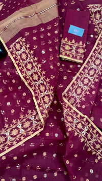 Maroon cotton jamdani with yellowish threads work.