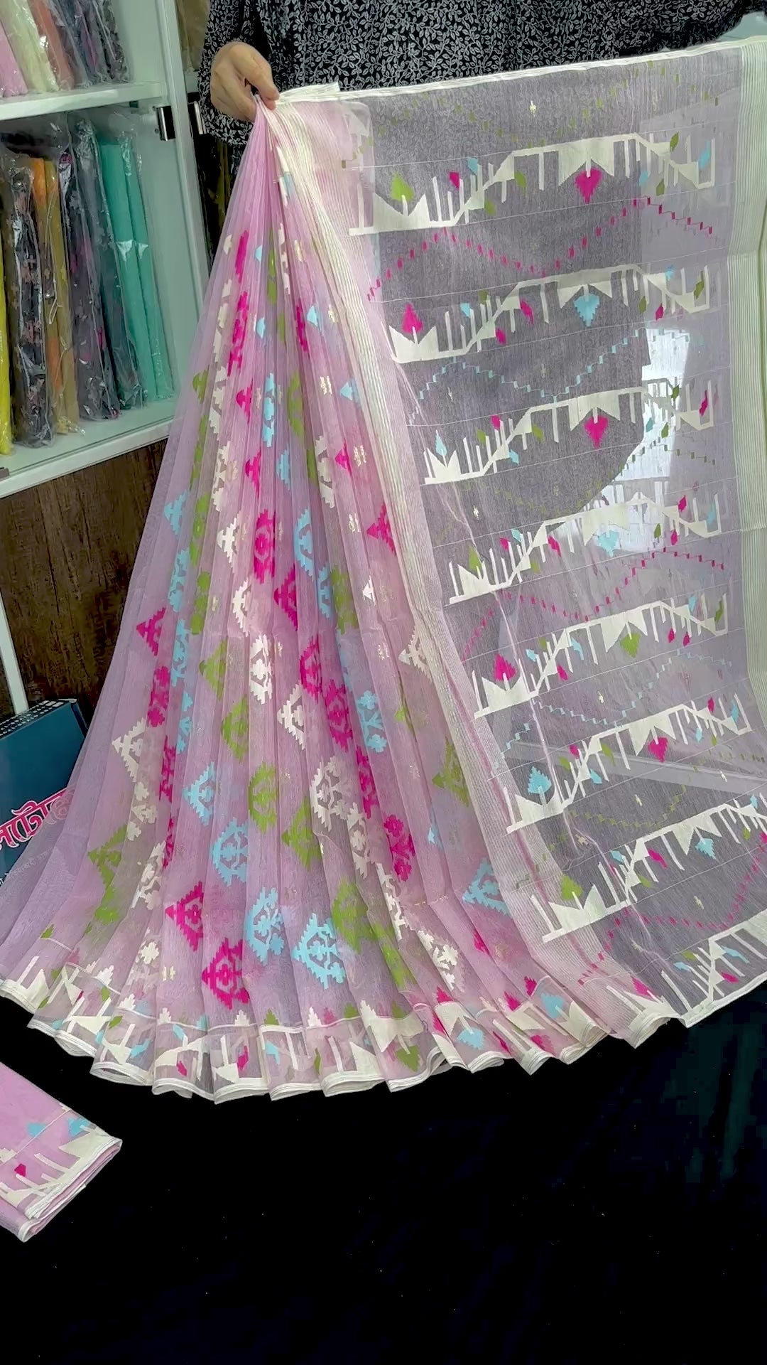 Baby pink halfsilk jamdani saree with blue magenta green off white threads work